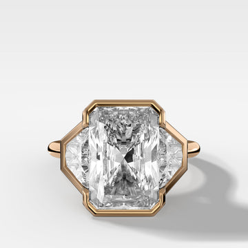 Three Stone Bezel Set Engagement Ring with Trapezoid Side Diamonds and an Elongated Radiant Cut