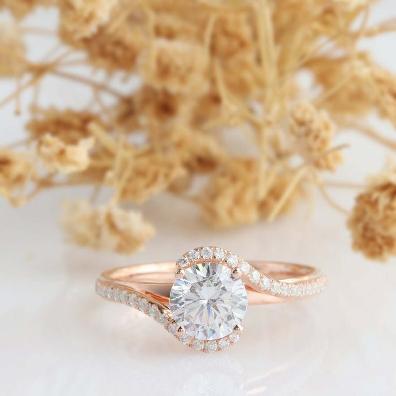 1-carat-round-moissanite-bypass-engagement-ring-rose-gold