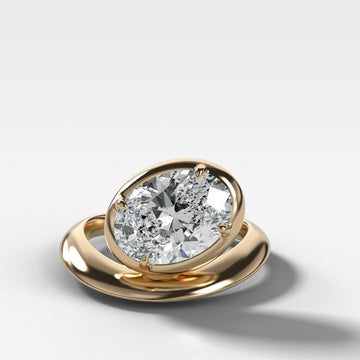 Contoured Club Engagement Ring with an Oval Cut Diamond