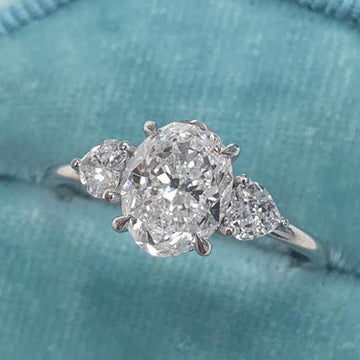 1.50ct Oval Cut Moissanite Three Stone Heart Accent Diamond Engagement Ring