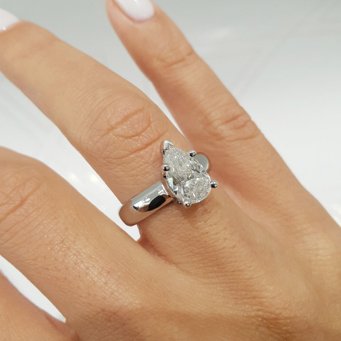 1.33 Cart Pear Moissanite Solitaire Broad Engagement Ring