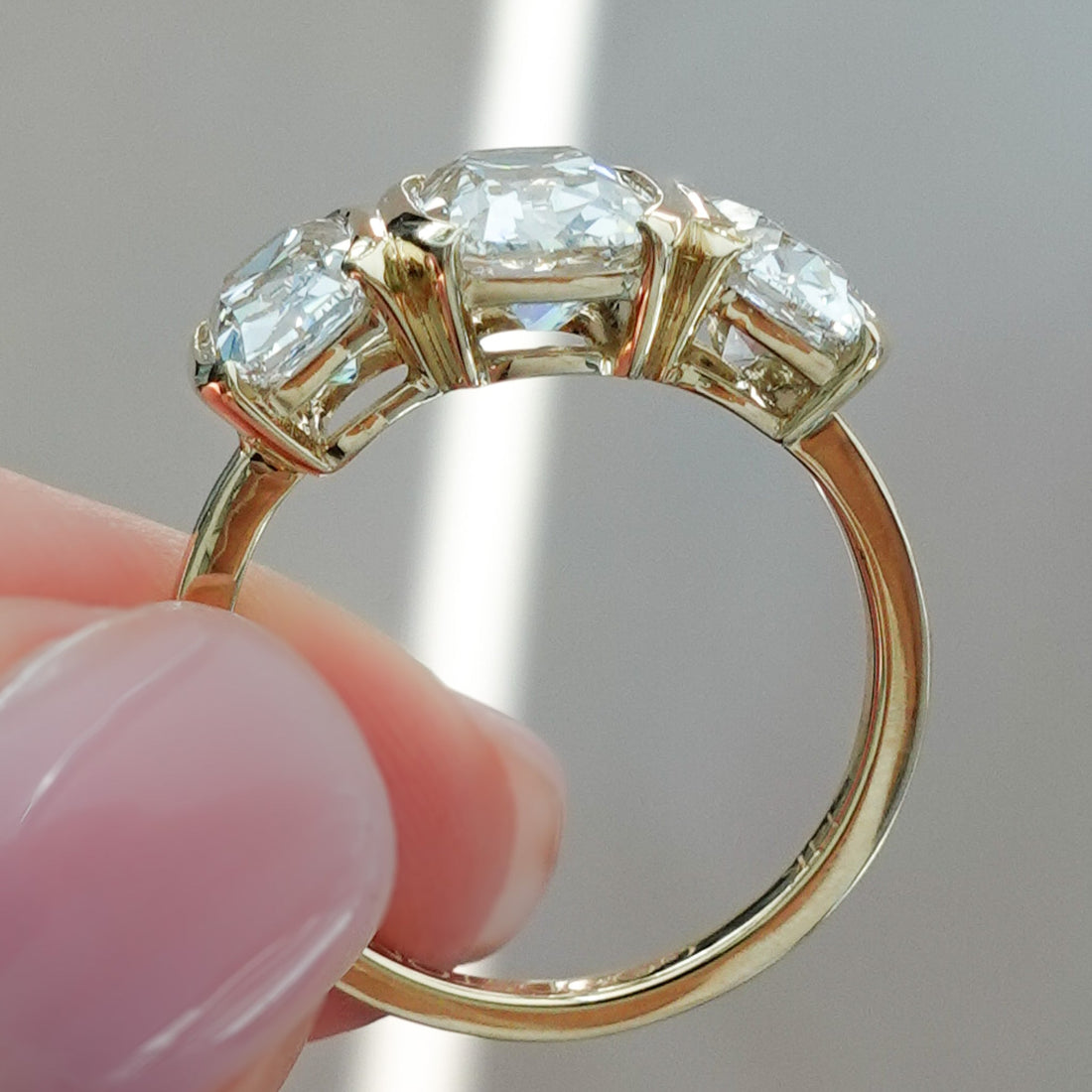 Half Bezel Triad Engagement Ring With Elongated Old Mine Cut Diamonds
