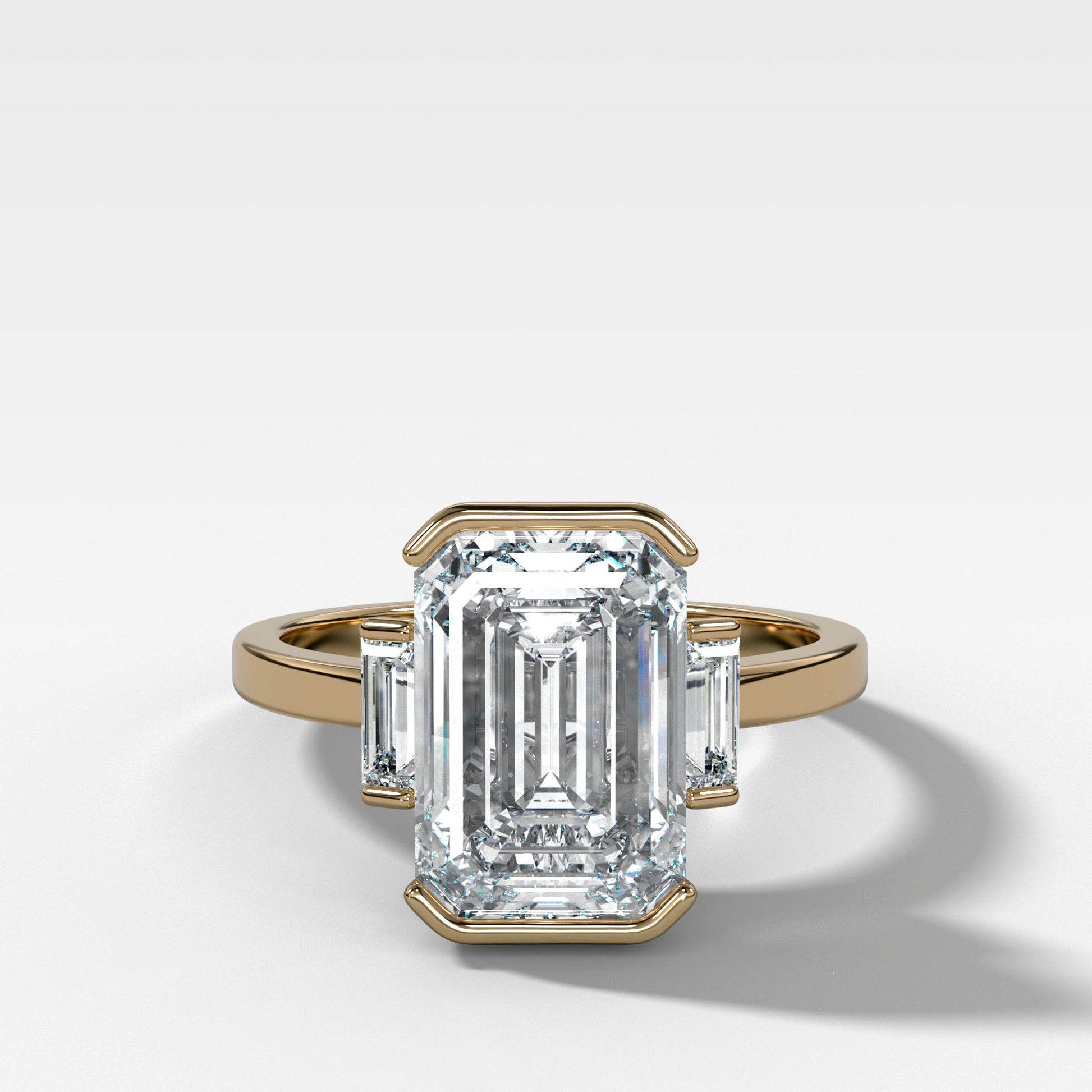 emerald-cut-half-bezel-engagement-ring-baguette-sides