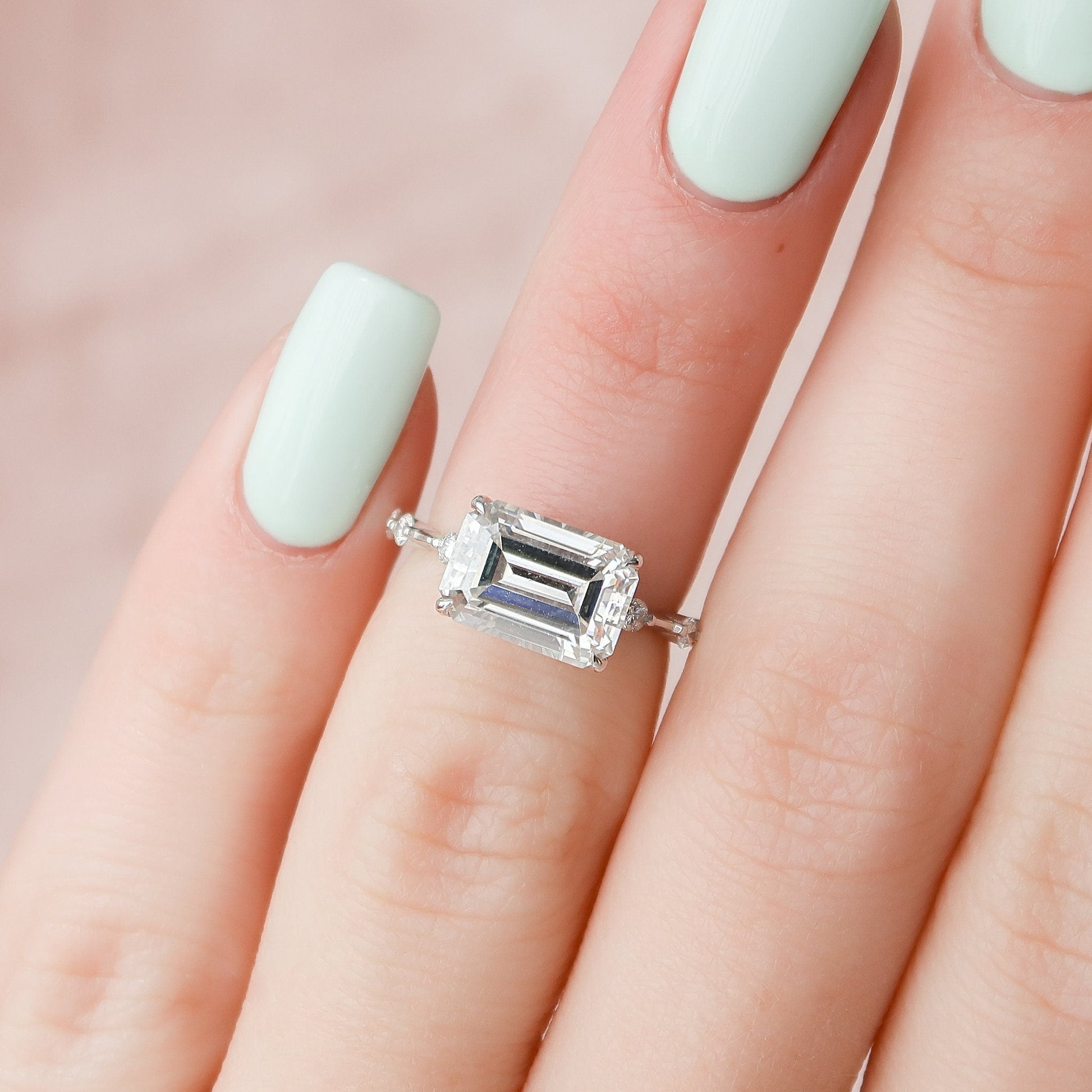 horizontal-emerald-cut-engagement-ring-dainty-band