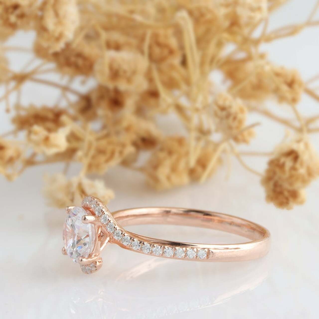 unique-swirl-setting-moissanite-ring-on-hand